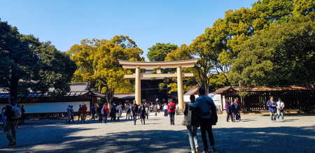 Japan on April 2019. Tourists walking at the entrance of the Harajuku City Forest heading to Meiji Shrine. Meiji Shrine is famous for its Yoyogi Park and Harajuku City Forest.のeditorial素材