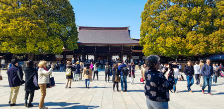 Japan on April 2019. Tourists from Asia, India, America and Europe are visiting Meiji Temple. One of the most famous Shinto shrines in Japan located in Shibuya District, Tokyo.のeditorial素材