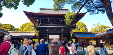 Japan on April 2019. Tourists from Asia, India, America and Europe are visiting Meiji Temple. One of the most famous Shinto shrines in Japan located in Shibuya District, Tokyo.のeditorial素材
