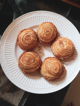 This chicken stuffed pastel with round shape and skin made of pastry is very delicious. The outer skin is very crispy and the filling inside is very dense with chicken and vegetables.の写真素材