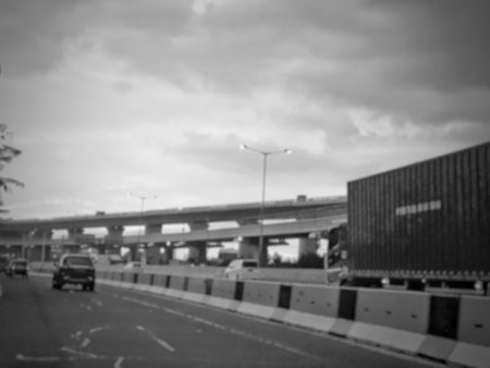 Defocused blurred abstract photo of the Jakarta Cikampek toll road in the afternoon at sunset with a very beautiful reddish orange twilight sky. Blurred photo.の写真素材