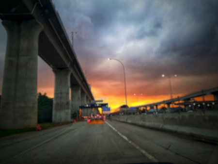 Defocused blurred abstract photo of the Jakarta Cikampek toll road in the afternoon at sunset with a...