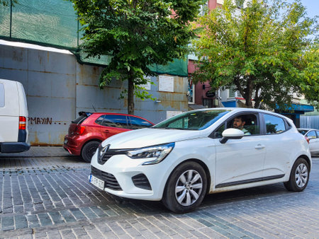 Turkey on July 2022. Cars parked on the side of the Kucuk Ayasofya Cd Sultanahmet road, Istanbul Turkey. Narrow roads and no parking spaces cause these cars to park on the side of the road.のeditorial素材
