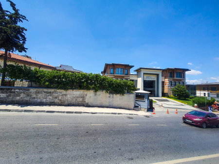 Turkey on July 2022. Street conditions on a street in a suburban city of Turkey where there are old buildings, simple flats and walls scrawled with street murals.のeditorial素材