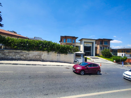 Turkey on July 2022. Street conditions on a street in a suburban city of Turkey where there are old buildings, simple flats and walls scrawled with street murals.のeditorial素材