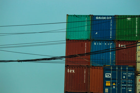 jakarta, Indonesia in October 2022. Stacks of containers of various colors are in an export-import warehouse. This warehouse is guarded by a security guard so that no one enters carelessly.の写真素材
