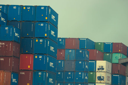 jakarta, Indonesia in October 2022. Stacks of containers of various colors are in an export-import warehouse. This warehouse is guarded by a security guard so that no one enters carelessly.の写真素材