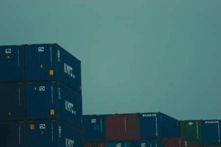 jakarta, Indonesia in October 2022. Stacks of containers of various colors are in an export-import warehouse. This warehouse is guarded by a security guard so that no one enters carelessly.の写真素材