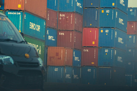 jakarta, Indonesia in October 2022. Stacks of containers of various colors are in an export-import warehouse. This warehouse is guarded by a security guard so that no one enters carelessly.の写真素材