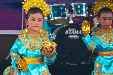Jakarta, Indonesia in November 2022. Young children ranging from kindergarten to elementary school are taking part in the National Archipelago dance competition. The dances and clothing displayed are typical dances from regions in Indonesia.のeditorial素材