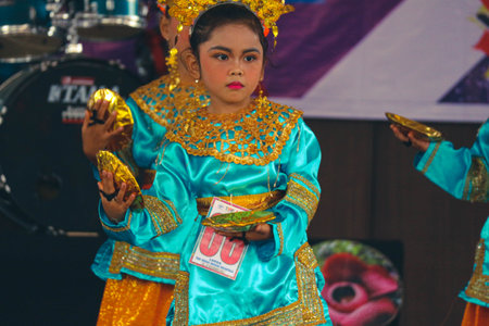 Jakarta, Indonesia in November 2022. Young children ranging from kindergarten to elementary school are taking part in the National Archipelago dance competition. The dances and clothing displayed are typical dances from regions in Indonesia.のeditorial素材