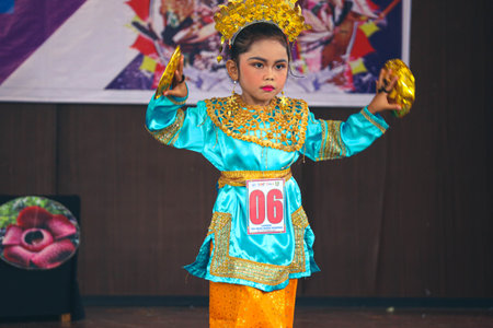 Jakarta, Indonesia in November 2022. Young children ranging from kindergarten to elementary school are taking part in the National Archipelago dance competition. The dances and clothing displayed are typical dances from regions in Indonesia.のeditorial素材