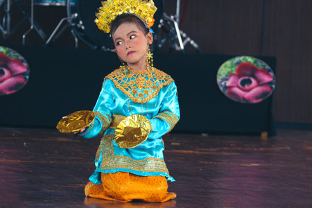 Jakarta, Indonesia in November 2022. Young children ranging from kindergarten to elementary school are taking part in the National Archipelago dance competition. The dances and clothing displayed are typical dances from regions in Indonesia.のeditorial素材