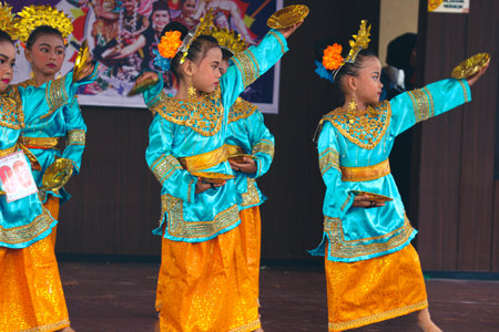 Jakarta, Indonesia in November 2022. Young children ranging from kindergarten to elementary school are taking part in the National Archipelago dance competition. The dances and clothing displayed are typical dances from regions in Indonesia.のeditorial素材