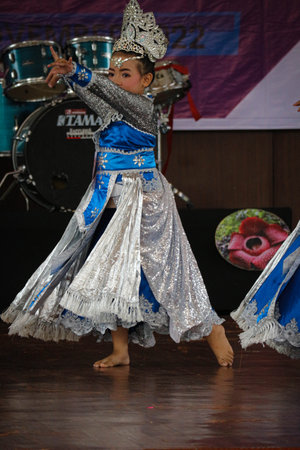 Jakarta, Indonesia in November 2022. Young children ranging from kindergarten to elementary school are taking part in the National Archipelago dance competition. The dances and clothing displayed are typical dances from regions in Indonesia.のeditorial素材