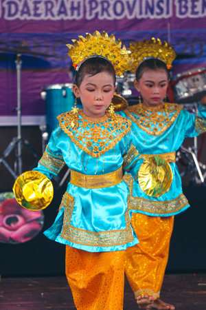 Jakarta, Indonesia in November 2022. Young children ranging from kindergarten to elementary school are taking part in the National Archipelago dance competition. The dances and clothing displayed are typical dances from regions in Indonesia.のeditorial素材