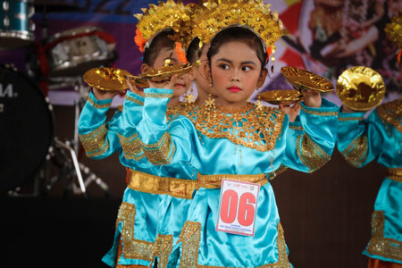 Jakarta, Indonesia in November 2022. Young children ranging from kindergarten to elementary school are taking part in the National Archipelago dance competition. The dances and clothing displayed are typical dances from regions in Indonesia.のeditorial素材