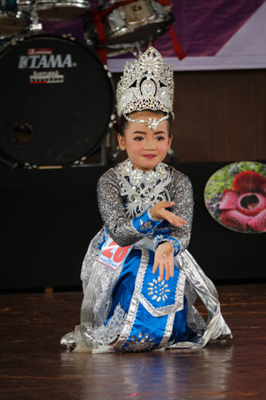 Jakarta, Indonesia in November 2022. Young children ranging from kindergarten to elementary school are taking part in the National Archipelago dance competition. The dances and clothing displayed are typical dances from regions in Indonesia.のeditorial素材