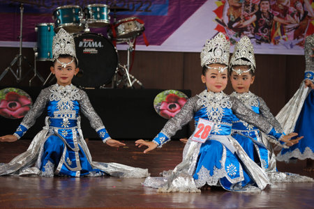 Jakarta, Indonesia in November 2022. Young children ranging from kindergarten to elementary school are taking part in the National Archipelago dance competition. The dances and clothing displayed are typical dances from regions in Indonesia.のeditorial素材