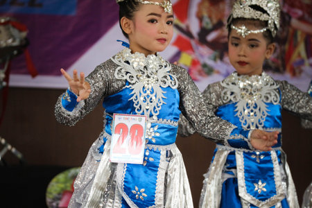 Jakarta, Indonesia in November 2022. Young children ranging from kindergarten to elementary school are taking part in the National Archipelago dance competition. The dances and clothing displayed are typical dances from regions in Indonesia.のeditorial素材