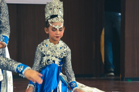 Jakarta, Indonesia in November 2022. Young children ranging from kindergarten to elementary school are taking part in the National Archipelago dance competition. The dances and clothing displayed are typical dances from regions in Indonesia.のeditorial素材