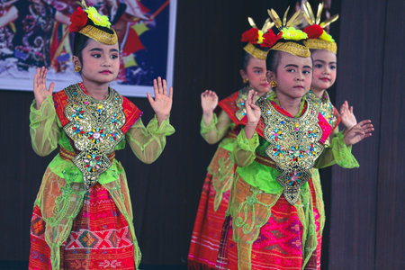 Jakarta, Indonesia in November 2022. Young children ranging from kindergarten to elementary school are taking part in the National Archipelago dance competition. The dances and clothing displayed are typical dances from regions in Indonesia.のeditorial素材
