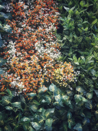 Imitation plants in the form of orange-brown flowers and green leaves are very beautiful and can be used as a background or backdrop.の写真素材