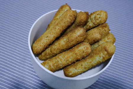 Chicken finger nuggets or chicken nuggets in the form of sticks. Soft chicken meat wrapped in crispy...