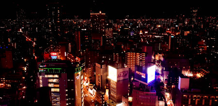 Osaka, Japan in July 2019. Nighttime view of the city of Osaka or 'The Nation's Kitchen,' from different heights and angles aboard the HEP FIVE Ferris Wheel in Kansai. It's one of the iconic landmarks of Umeda.のeditorial素材