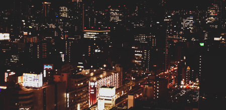 Osaka, Japan in July 2019. Nighttime view of the city of Osaka or 'The Nation's Kitchen,' from different heights and angles aboard the HEP FIVE Ferris Wheel in Kansai. It's one of the iconic landmarks of Umeda.のeditorial素材