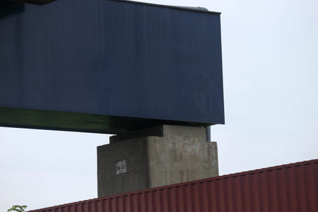 The blue bolts and nuts of the structure with large dimensions are made of high quality steel, high tensile steel which functions as an anchor to connect the pedestal foundation structure to the bridge column steel structure.の写真素材