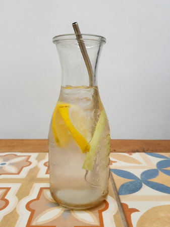 Lemon and lemongrass ice drink, very refreshing. Served in an attractive long glass bottle, with an environmentally friendly stainless steel straw.の写真素材
