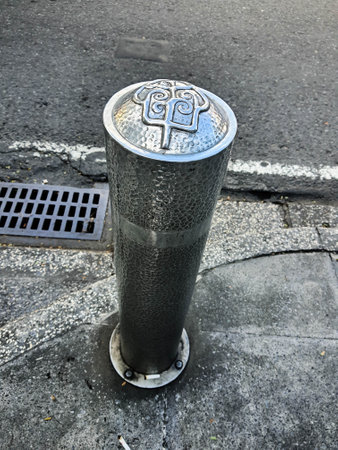 Pedestrian facilities on the Malioboro sidewalks include steel pipe bollards with traditional ornaments or motifs printed on them in the form of wayang, carriage and pedicab motifs. Architectural bollards can be placed over these steel posts to give them a classical decorative aesthetic.の写真素材