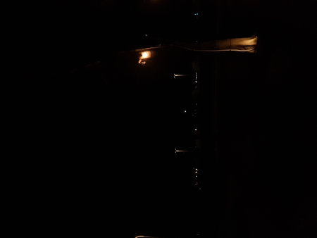 Garden lights shining at night. Bright enough but not enough to illuminate because the surroundings are still dark.の写真素材