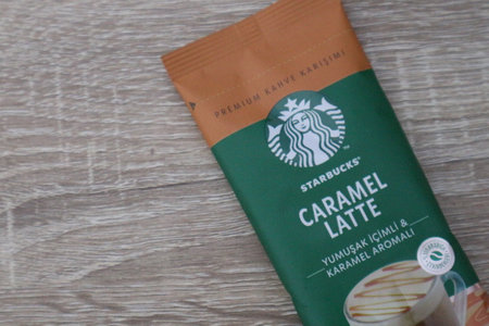 Bekasi, Indonesia on July 2022. Copy space starbucks caramel latte sachet, Starbucks premium instant coffee sachet original from Turkey. We can enjoy Starbucks coffee easily from home.のeditorial素材