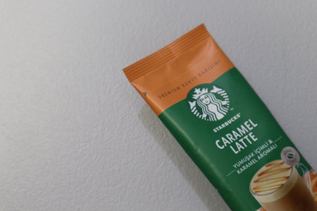 Bekasi, Indonesia on July 2022. Copy space starbucks caramel latte sachet, Starbucks premium instant coffee sachet original from Turkey. We can enjoy Starbucks coffee easily from home.のeditorial素材