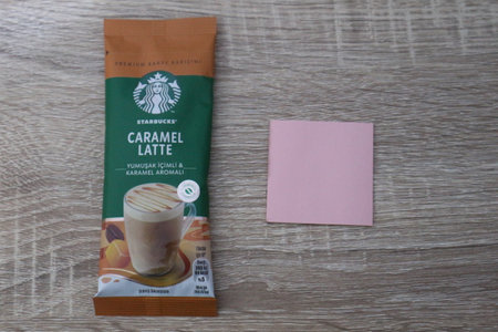 Bekasi, Indonesia on July 2022. Copy space starbucks caramel latte sachet, Starbucks premium instant coffee sachet original from Turkey. We can enjoy Starbucks coffee easily from home.のeditorial素材