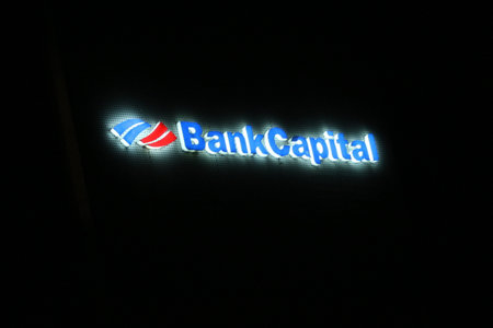 Bekasi, Indonesia in July 2022. The logo of Bank Capital shining brightly at night against the dark night sky. Bank Capital Indonesia Tbk (BACA) was established on April 20, 1989 under the name PT Bank Credit Lyonnais Indonesiaのeditorial素材