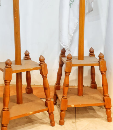 Photo of an indoor flagpole stand made of wood. It has four legs as a solid base so it doesn't fall easily. Very traditional with very good quality.の写真素材