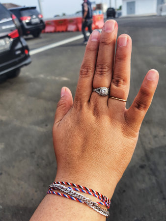 Hands of a healthy fat woman, her hands wear rings and bracelets.の写真素材