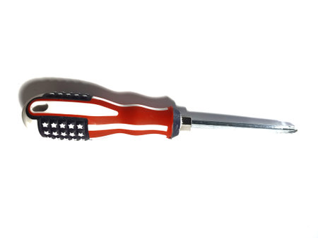 Isolated white photo of a steel screwdriver with a usa flag patterned handle.の写真素材