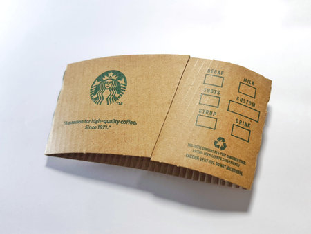 Jakarta, Indonesia in July 2022. Isolated white photo of Sleeve Starbuck Cup. Sleeve for hot drink...