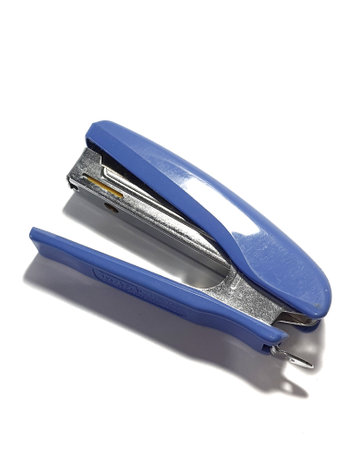 West Java, Indonesia on July 2022. Isolated white photo of a blue stapler. This stapler serves to unite paper or documents.のeditorial素材