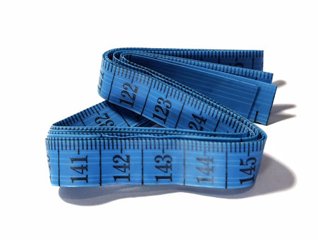 Isolated white photo of a sewing meter or fabric meter in blue. This multi-function measuring tool...