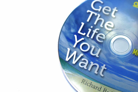 Jakarta, Indonesia in July 2022. Isolated white photo of the Compact Disc or CD of the book Get the life you want by Richard Bandler, co-creator of renowned NLP and mentor of Paul McKenna, believes you can be anyone you want.のeditorial素材