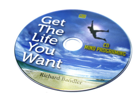 Jakarta, Indonesia in July 2022. Isolated white photo of the Compact Disc or CD of the book Get the life you want by Richard Bandler, co-creator of renowned NLP and mentor of Paul McKenna, believes you can be anyone you want.のeditorial素材