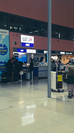 Osaka, Japan on April 9, 2019. A collection of sim card and wifi sales counters to meet the internet needs of foreigners visiting Japan. This counter is located at Kansai International Airport.のeditorial素材