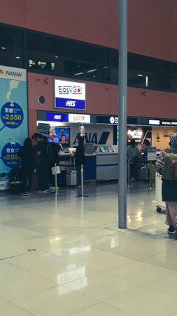Osaka, Japan on April 9, 2019. A collection of sim card and wifi sales counters to meet the internet needs of foreigners visiting Japan. This counter is located at Kansai International Airport.のeditorial素材
