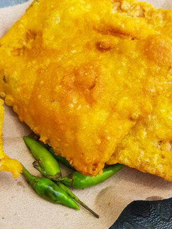 Mendoan is tempeh that wrapped in seasoned flour and then fried until crisp.