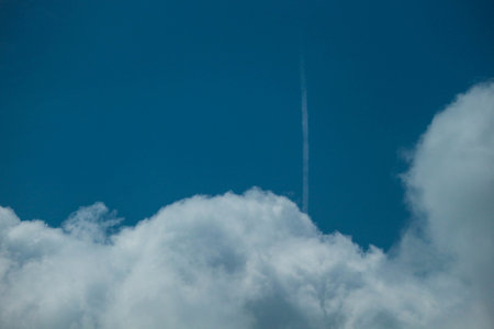 Big white clouds that look very soft against the bright blue sky. It's great to see. Suitable for your template background.の写真素材